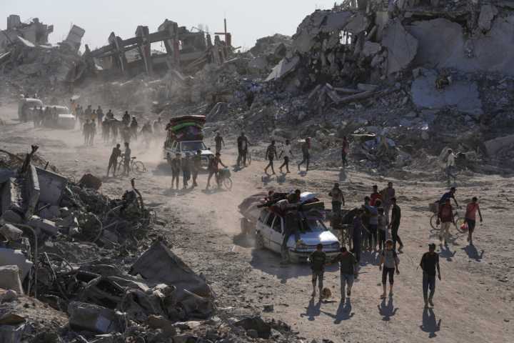 Some Palestinians pack up and move north toward their homes in Gaza after ceasefire goes into effect