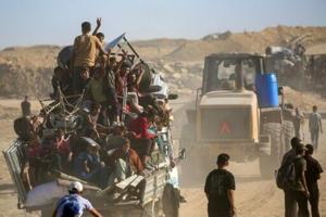 Palestinians return to devastated Gaza City as truce holds