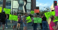 Protesters stand on opposed ideas for ending homelessness