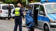 First picture of son quizzed by cops after brutal stabbing of his mayor mum as she fights for her life in hospital
