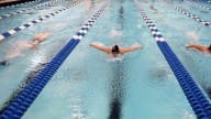Former Kentucky swim coach banned permanently from coaching