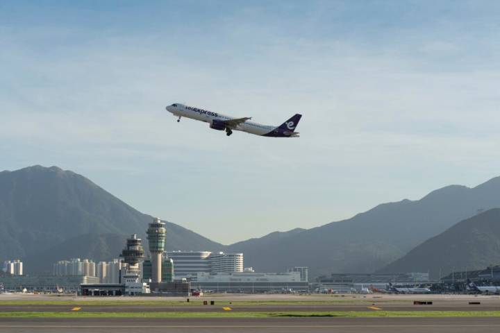 A cargo aircraft skids off a Hong Kong runway into the sea, killing 2 airport workers