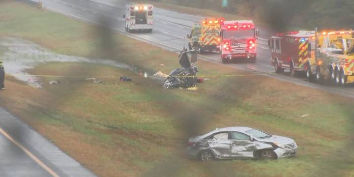 Plane crashes onto a Massachusetts highway, killing 2 and wounding 1 on the ground