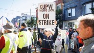 Striking Toronto postal workers protest proposed Canada Post changes