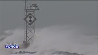 Dozens rescued as remnants of typhoon hits Alaska while nor’easter brings flooding to East Coast