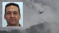 Hunt for cop killer continues as national park reopens