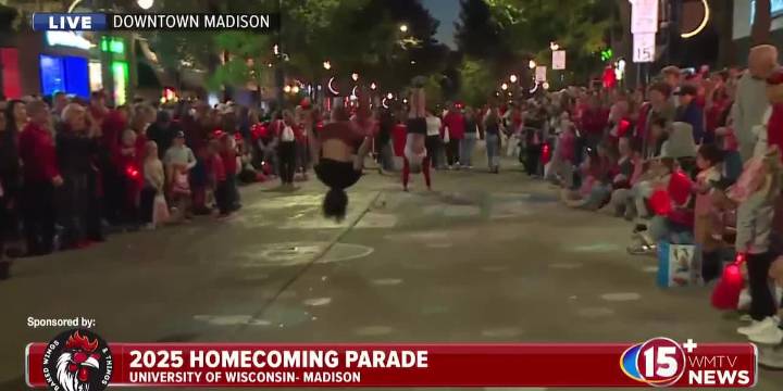 Jocko talks with member of Gymnastics Club during parade