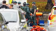 Four hurt, person shot by police near Manchester synagogue