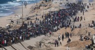 Displaced Palestinians begin return to war-ravaged Gaza with Israel