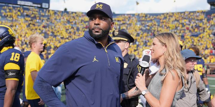 Michigan and coach Moore drop appeal of NCAA penalties from sign