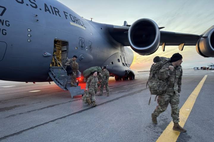 Officials airlift evacuees to safety after the remnants of Typhoon Halong devastate Alaska villages
