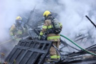 Garage, vehicle engulfed in flames