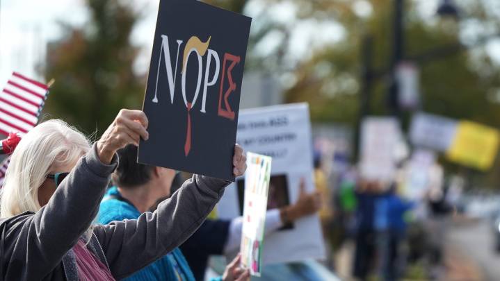 Mad with different messages. Hundreds attend No Kings rally in Falls