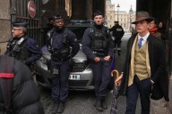 Inspector Clouseau? The mystery man photographed after the Louvre jewel heist creates a buzz