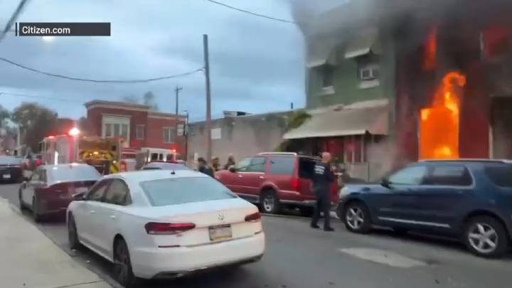 Flames shoot from burning home in Strawberry Mansion