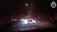 Dramatic new video emerges of cop car rammed in high-speed teen crime spree on Gold Coast