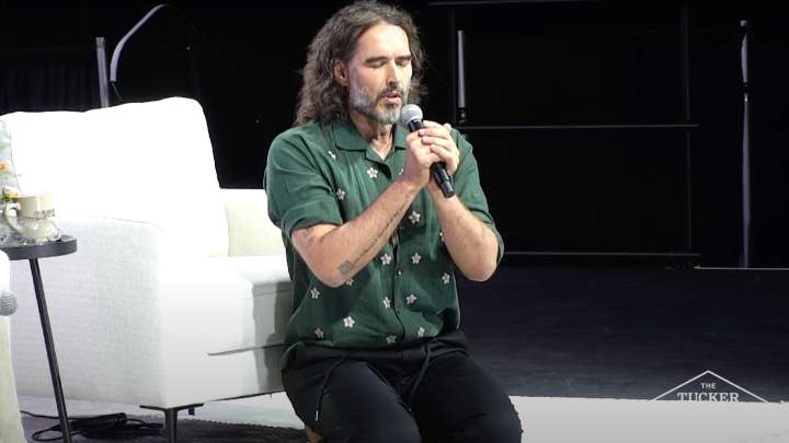 Russell Brand prays in Jesus' name at TPUSA event