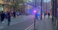 City centre street taped off after fire erupts in apartment block