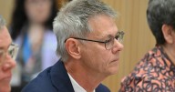 Department of Climate Change, Energy, the Environment and Water boss Mike Kaiser defends background