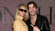 Patrick Schwarzenegger supports model wife as she hits Victoria's Secret runway in sultry lingerie