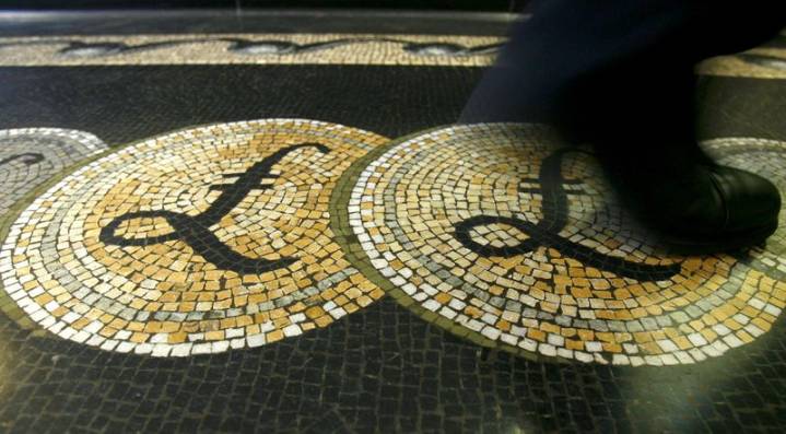 Sterling drops after UK data shows softer wage growth