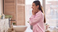 Dollar Tree Flower Vases Are The Perfect Solution For This Bathroom Storage