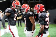 Falcons defeat Bills 24-14 as Robinson matches career high statistic