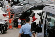 Hong Kong lawmakers pass bill to regulate ride-hailing services like Uber – Winnipeg Free Press