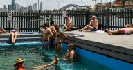 Snap heatwave breaks records as winds wreak havoc