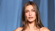 Hailey Bieber rocks knee-high boots and a leather skirt
