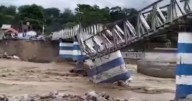 Massive landslide kills 24, including 7 children, as video shows building collapse into river