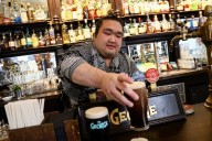 Sumo wrestlers dine and pull pints in London – but what is their diet like?