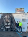 World-renowned artist Wyland creates Detroit Lions mural at family business in Clawson