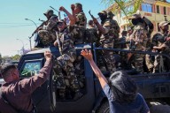 Madagascar president has left the country after soldiers turned against him, lawmaker says