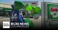 Brentwood gas station owner dresses up dinosaur in Dodgers gear