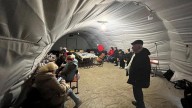 Swarms of Russian drones plunge parts of Ukraine into darkness, as Zelensky turns to Europe again