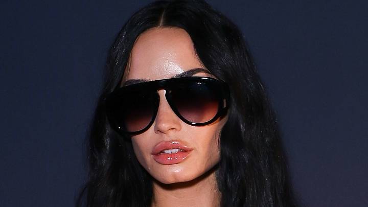 Demi Lovato highlights tiny waist amid weight loss in revealing leather and lace look