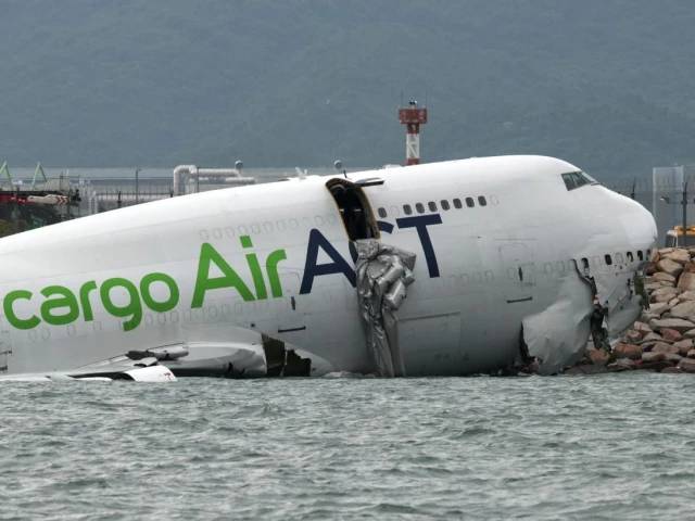 Two killed as cargo jet crashes off runway into sea at Hong Kong airport