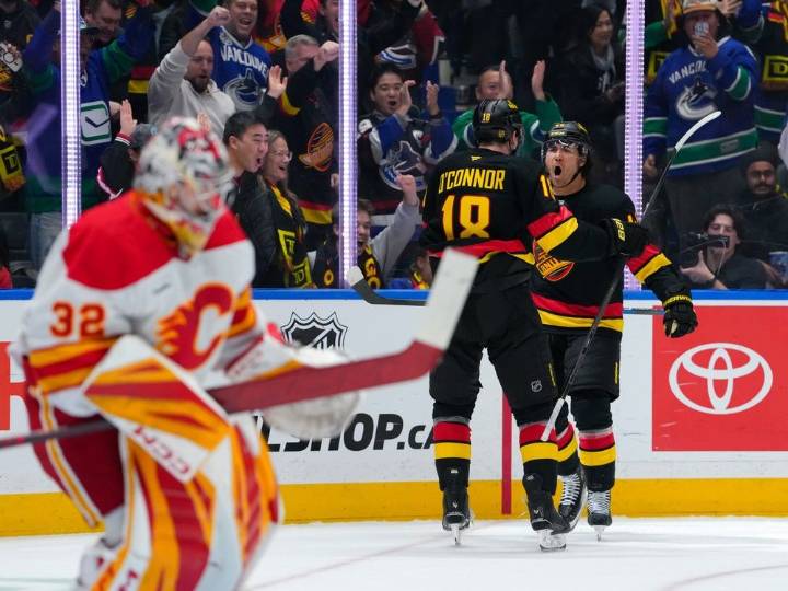 Photos: Canucks defeat Flames 5-1 in home opener at Rogers Arena