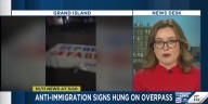 Anti-immigration signs hung on overpass in Grand Island