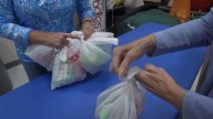 Volunteers help fight weekend hunger one bag at a time at New Albany's Slate Run Elementary