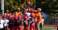 Second grader with cerebral palsy's dreams come true by scoring a touchdown with the help of his team