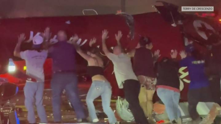 WATCH: Bystanders band together to save trapped medical crew after helicopter crash