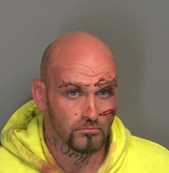 Accused shoplifter charged after trying to stab officer outside of Walmart