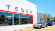 Parents of two students claim Tesla design flaw trapped them in fatal fire
