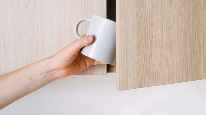 Clear Cabinet Space With A Simple Sliding Storage Solution For Coffee Mugs And Cups