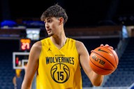 Missing its centers in first exhibition, Michigan success hindered