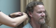 Hayes Elementary School principal chops hair to celebrate high attendance rates