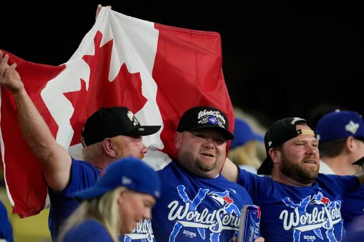'One more win!' Fans go wild as Blue Jays secure chance to win World Series in Toronto on Halloween