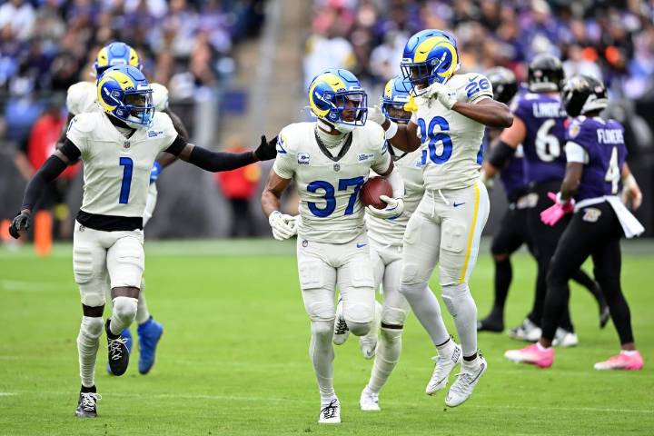 Quentin Lake, a budding star for Rams, manifested his first career interception